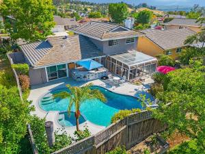 an aerial view of a house with a swimming pool at Charming Villa with Backyard Oasis Close to Beach in Laguna Hills