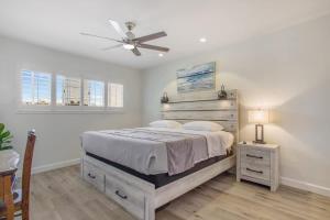 a bedroom with a bed and a ceiling fan at Charming Villa with Backyard Oasis Close to Beach in Laguna Hills