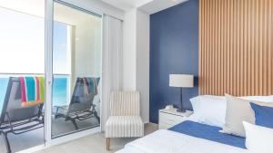 Ένα ή περισσότερα κρεβάτια σε δωμάτιο στο Encantame Towers Viento 1503 +23 φωτογραφίες