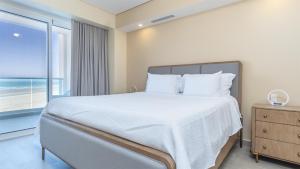 Voodi või voodid majutusasutuse Splash in The New Lazy River/Stay in Modern Luxury Encantame Viento 303 toas +21 fotot