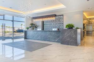 a lobby with a reception desk in a building at Beautiful 2 bedroom condo Encantame Tower E 802 in Puerto Peñasco +34 photos