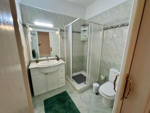a bathroom with a shower and a sink and a toilet at Casa Alba in La Mareta +21 photos