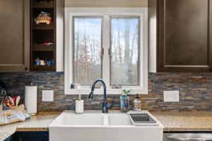 a kitchen with a sink and a window at Cozy Mountain Song- Massanutten Mountain in McGaheysville