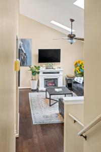 a living room with a fireplace and a tv at Cozy Mountain Song- Massanutten Mountain in McGaheysville +32 photos