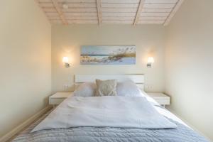 Ένα ή περισσότερα κρεβάτια σε δωμάτιο στο Bai E Dik 20