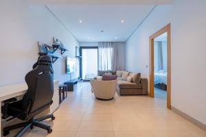 a living room with a desk and a office chair at C07- Pestana - Luxury Hotel Flat - Terrace - Pool in Casablanca