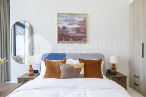 En eller flere senge i et værelse på Bloomfields Snug Stu The Gate Masdar