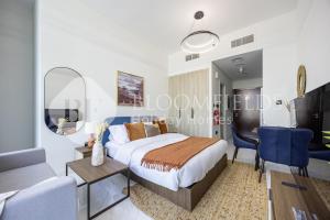 En eller flere senge i et værelse på Bloomfields Snug Stu The Gate Masdar