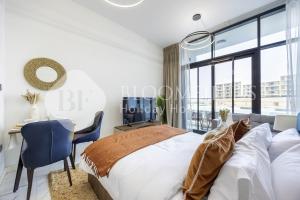 En eller flere senge i et værelse på Bloomfields Snug Stu The Gate Masdar