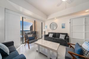 a living room with a couch and a table at 1BR 1BA Ocean View Las Palomas Phase 1 Bld Ruby in Puerto Peñasco