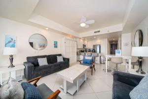 a living room with a couch and a table at 1BR 1BA Ocean View Las Palomas Phase 1 Bld Ruby in Puerto Peñasco +62 photos