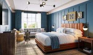 a bedroom with a bed and a living room at The Union Hotel, Flemington, a Tribute Portfolio Hotel in Flemington