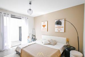 Ένα ή περισσότερα κρεβάτια σε δωμάτιο στο Le Cocoon