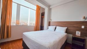 Postel nebo postele na pokoji v ubytování Huara Hs + 17 fotografií