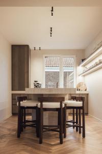 a kitchen with a large wooden table and chairs at LEO - Antwerp in Antwerp