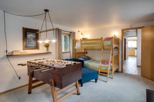 a living room with a chess board on a table at Hot Tub! Ocean Front & Dog Friendly! Ocean Watch in Holiday Beach