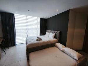 a bedroom with two beds with a teddy bear on them at Harmony Coliving Ecuador Pool Carolina Park Quito in Quito