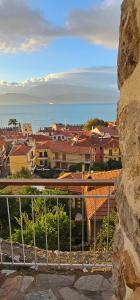 a view of a city with buildings and the ocean at Castle Balcony in Nafpaktos
