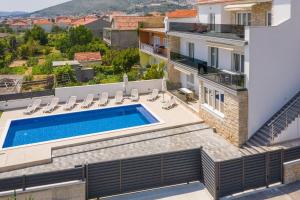 an image of a villa with a swimming pool at Apartments Apollo in Trogir