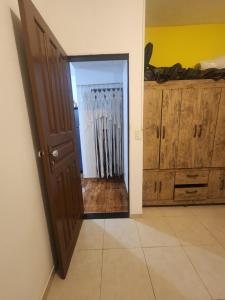 an open door to a room with a radiator at Kitnet Quintal verde in Itacaré