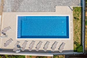 an overhead view of a swimming pool at Apartments Apollo in Trogir +36 photos