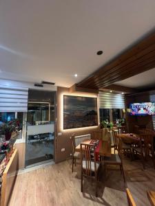 a dining room with a table and chairs at Hotel Akropoli in Tirana