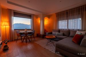 a living room with a couch and a table at Ain Chaouen in Chefchaouene
