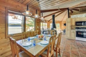 a dining room and kitchen with a table and chairs at All-Season Adventures! Chicaugon Lakefront Gem in Mapleton