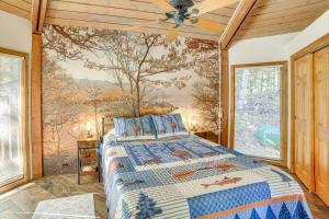 a bedroom with a bed in front of a window at All-Season Adventures! Chicaugon Lakefront Gem in Mapleton