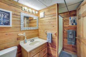 a bathroom with a sink and a toilet at All-Season Adventures! Chicaugon Lakefront Gem in Mapleton +34 photos
