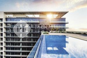 a rendering of a building with a swimming pool at Bloomfileds Cozy Stu in Park View in Mushayrib +11 photos