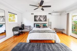 a bedroom with a bed and a ceiling fan at Modern 3BR Townhouse with Private Rooftop & Parking Minutes to NYC in Hoboken +47 photos
