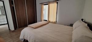 Postel nebo postele na pokoji v ubytování El Tipal