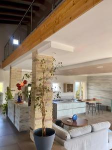 a living room with a white couch and a table at Loft Irene With Private Pool in Tergu