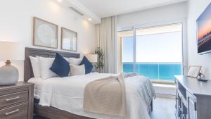 Ένα ή περισσότερα κρεβάτια σε δωμάτιο στο Encantame Towers Viento 1004 +19 φωτογραφίες