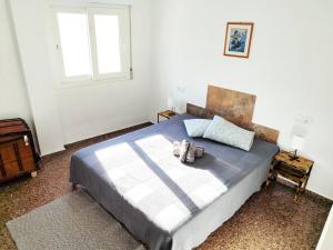 Ένα ή περισσότερα κρεβάτια σε δωμάτιο στο Encantador Estudio en Altea +6 φωτογραφίες