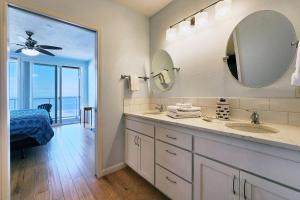 a bathroom with a sink and a mirror at Spectacular Ocean Front Condo with Community Club House & Pool! Whale Crossing in Depoe Bay +14 photos
