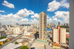 a view of a city with tall buildings at Hospedez - Flat Osasco Trade Center in Osasco
