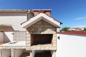 a bird house on the side of a building at Apartments Miljenka in Nin +55 photos