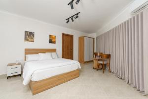 Giường trong phòng chung tại Rock Pyramids Hotel +37 ảnh