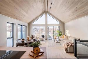 a living room with a couch and a table at New house in the center of Trysil 2 in Trysil