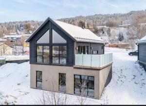 a house covered in snow with a roof at New house in the center of Trysil 2 in Trysil