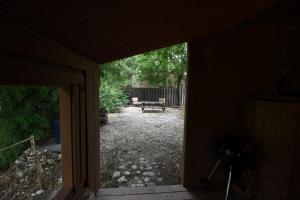a view of a patio from a door of a house at Jones Riverside Cabin in Utopia