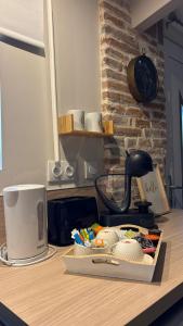a kitchen counter with a tray of food on it at Le Gîte de Cousal in Esperce