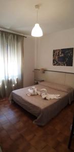 Postel nebo postele na pokoji v ubytování Hotel Ai Tufi