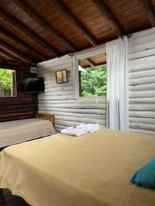 Postel nebo postele na pokoji v ubytování El Durazno Apart Hotel y Cabañas