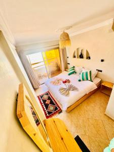 Postel nebo postele na pokoji v ubytování Natural Surf House