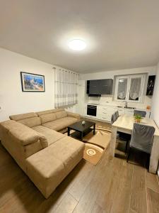 a living room with a couch and a table at Luino Family Retreat in Luino