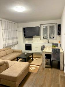 a living room with a couch and a table at Luino Family Retreat in Luino