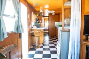 a kitchen with a checkered floor in an rv at Spartan Royal Mansion in Tombstone